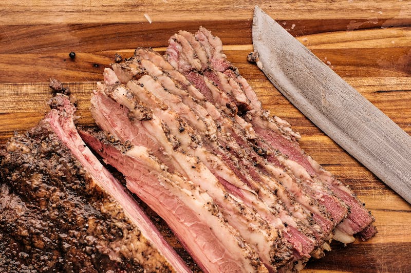 4 rivers BBQ slow-smoked beef brisket, sliced and plated